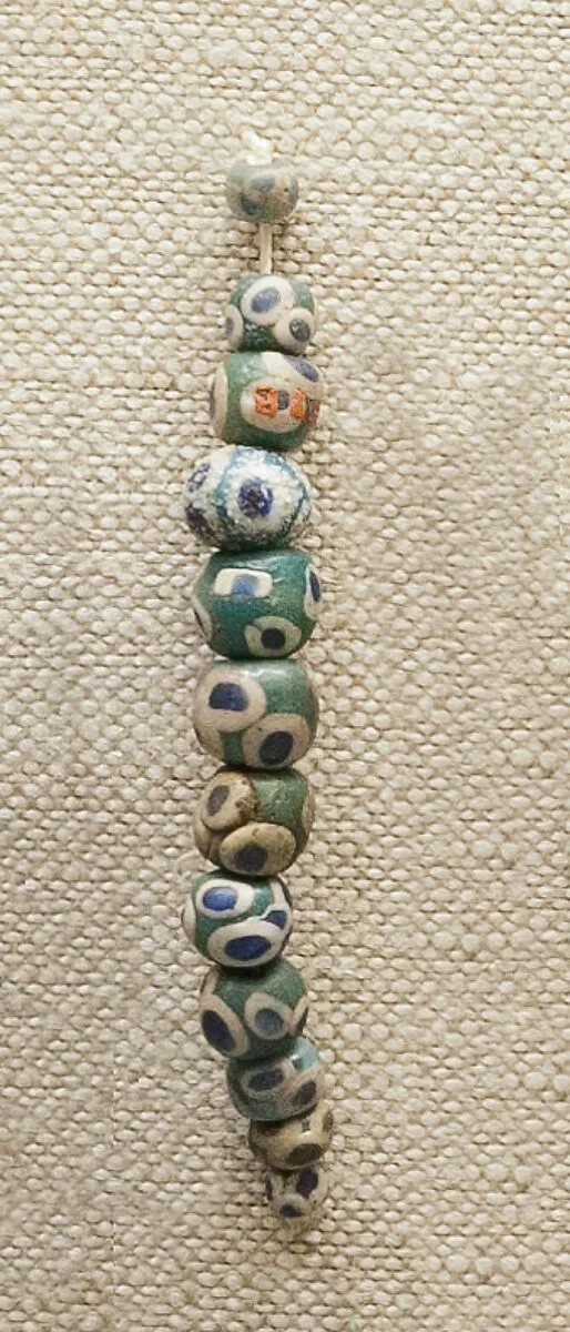 String of 12 Eyed Beads — Unknown