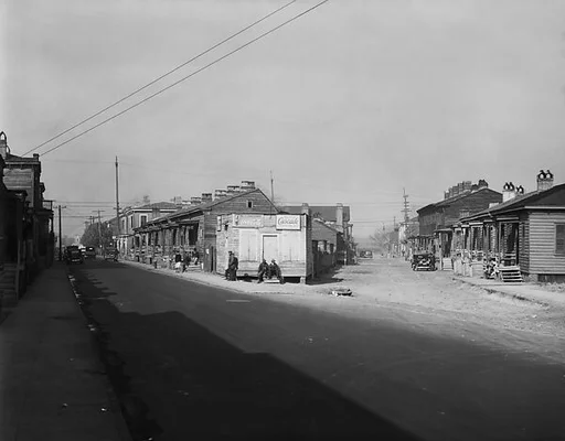 [Fork in Road with Two Rows of Wooden Houses and People on Corner, Savannah or Augusta, Georgia]