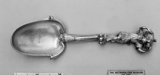 Figure-top spoon