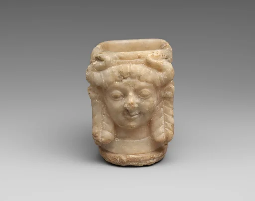 Vessel with heads of horned female deities