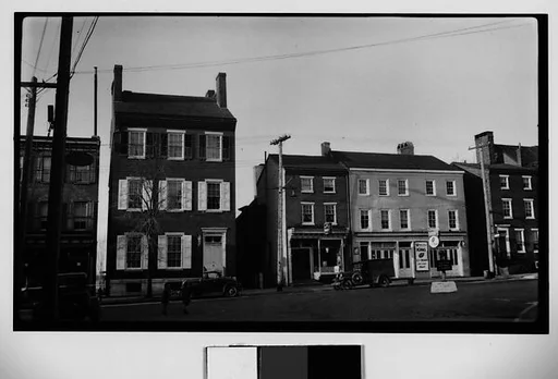 [Main Street Shops and Parked Cars]