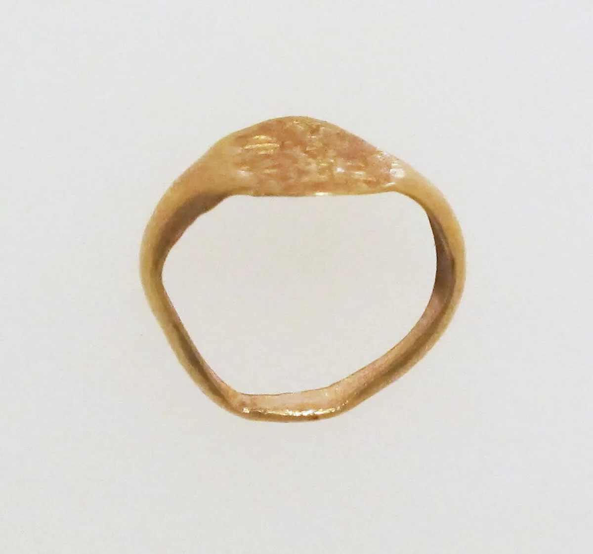 Gold ring with inscribed bezel — Unknown