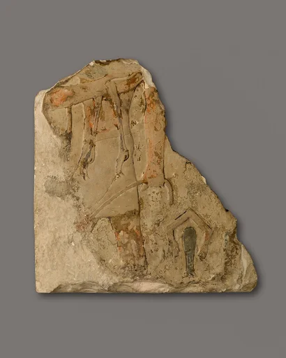Relief fragment of a man carrying an ostrich