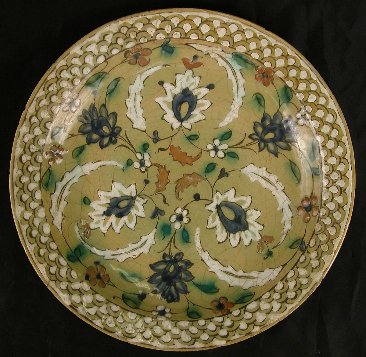 Dish with Floral Designs on an Olive Background — Unknown