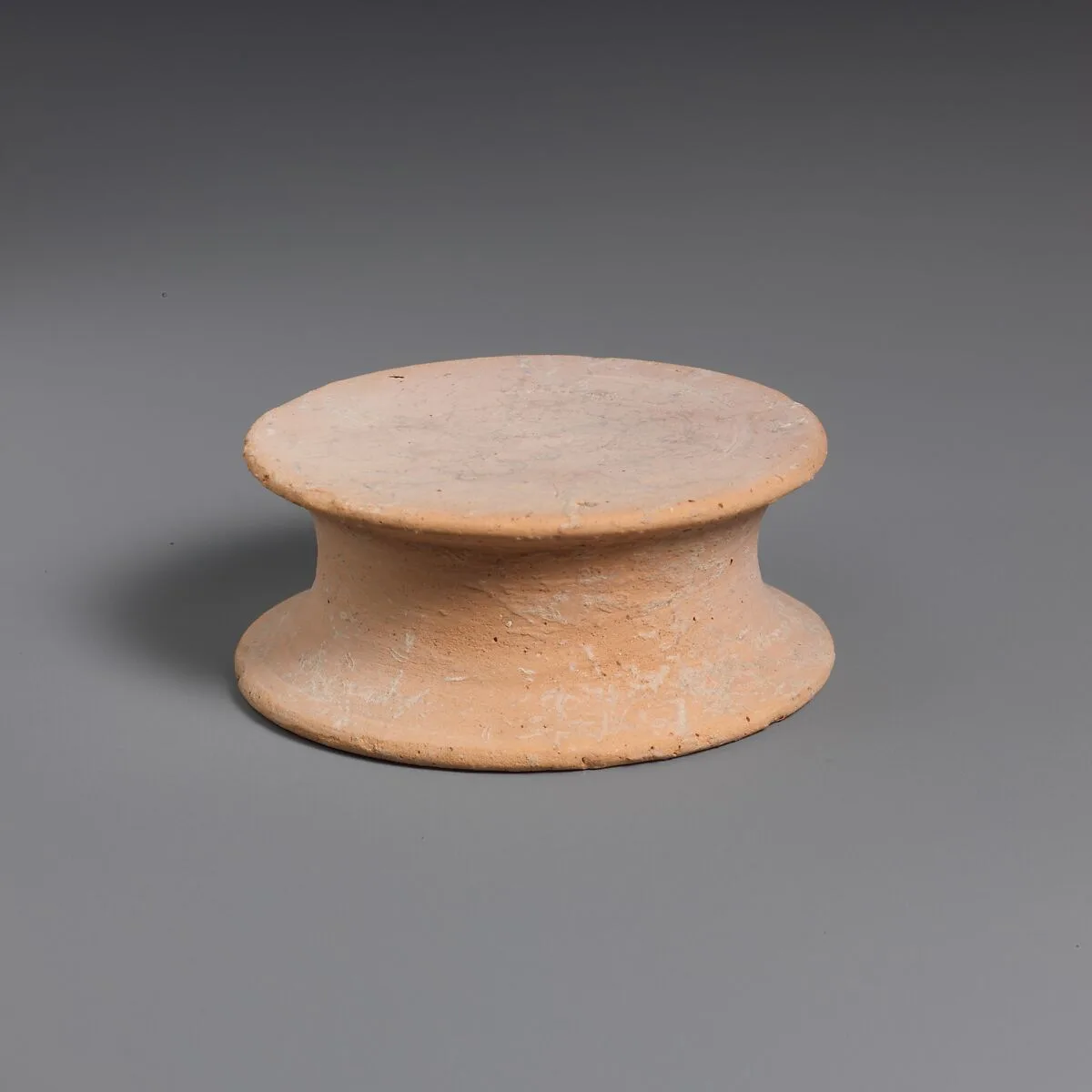 Terracotta statuette base — Unknown