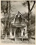 [Victorial Gothic House with Sign Reading "Felica Penso"
