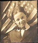 [Walker Evans, in Front of American Flag]