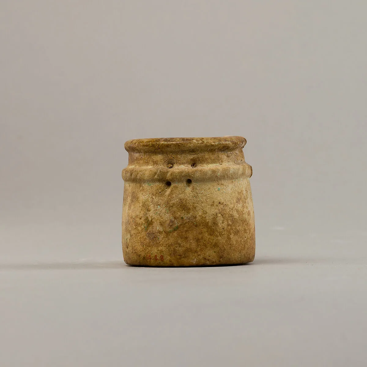Small cylindrical jar with raised rope band — Unknown