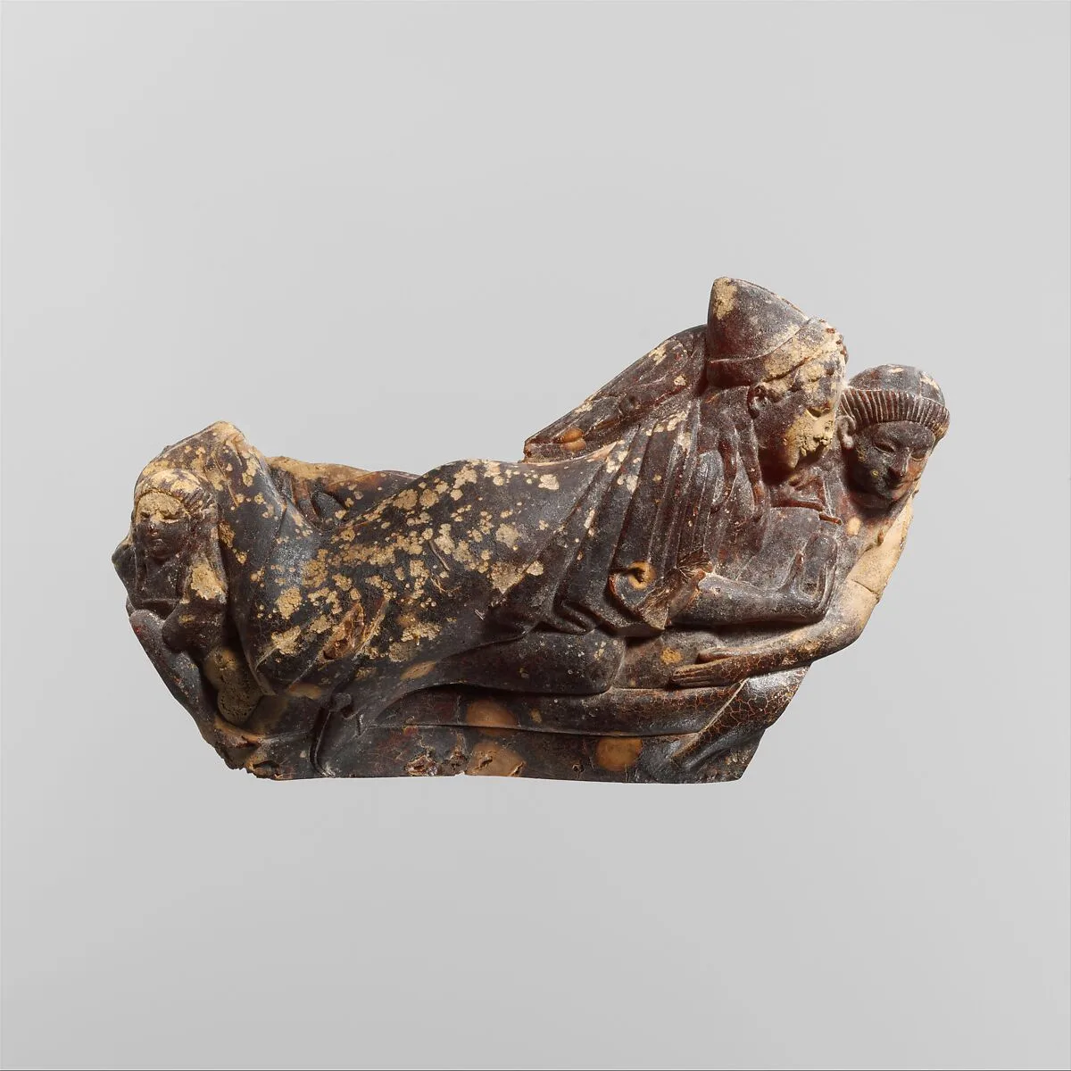 Carved amber bow of a fibula (safety pin) — Unknown