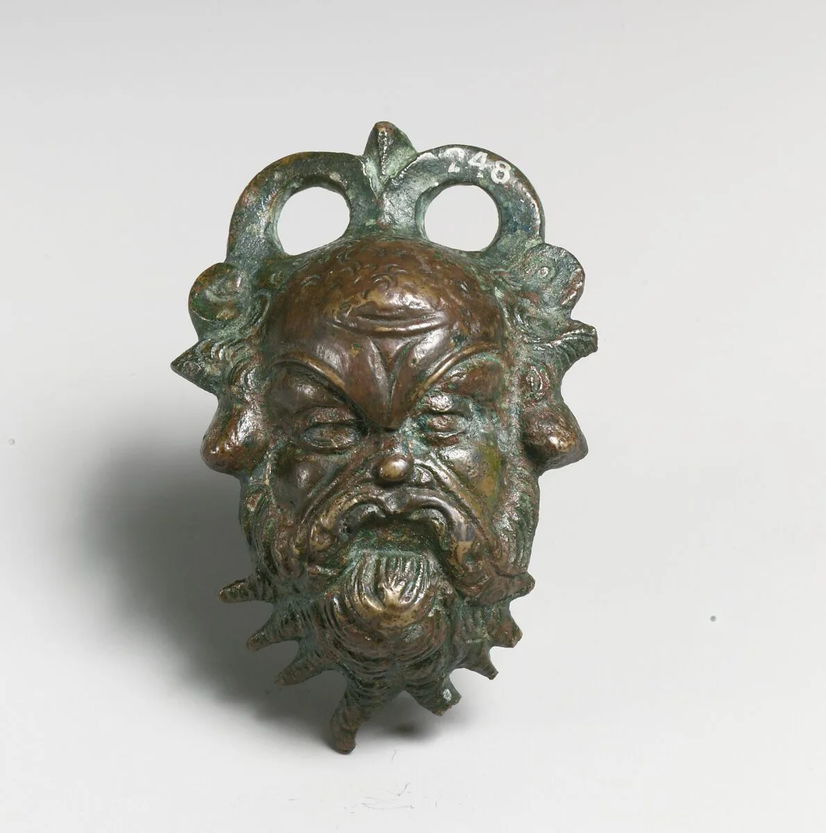 Bronze situla (pail) attachment in the form of a Silenos head — Unknown
