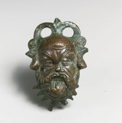 Bronze situla (pail) attachment in the form of a Silenos head