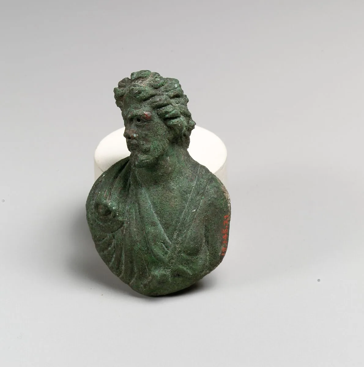Bronze appliqué in the form of a bust of a barbarian — Unknown