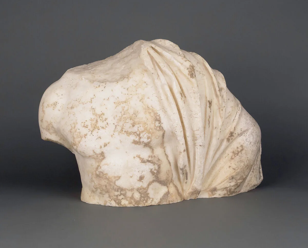 Upper part of a male draped torso — Unknown