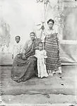 Family with two children, parents in Ewe kente cloth with painted backdrop — Alex Agbaglo Acolatse
