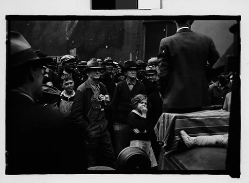 [Crowd Listening to Speaker Standing on Car Fender, Milledgeville, Georgia]