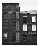 [Façade of Brick Buildings with Boarded Windows]