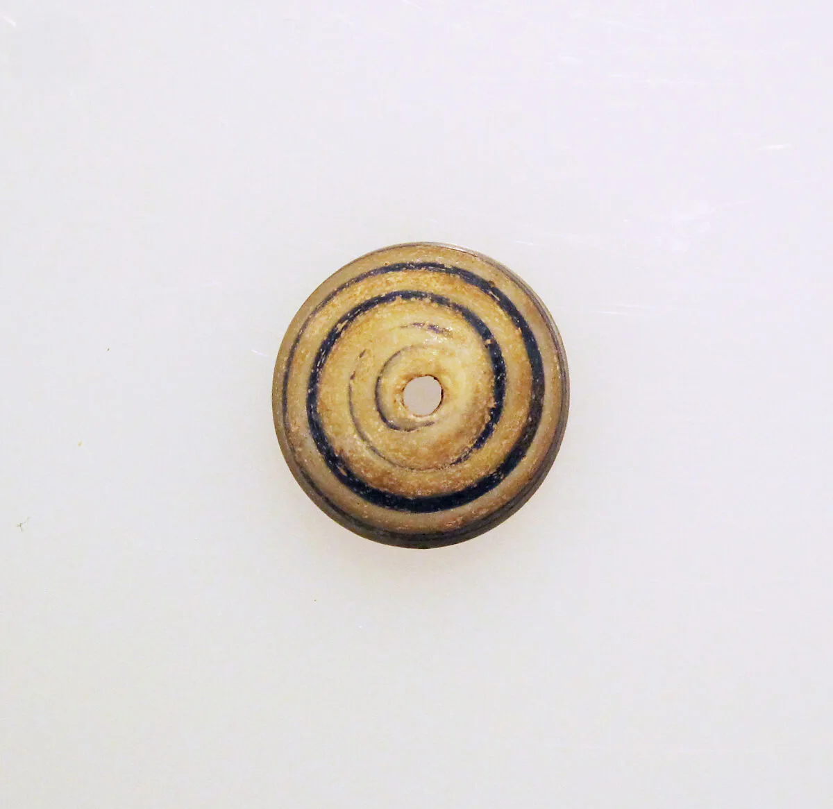 Glass spindle whorl — Unknown
