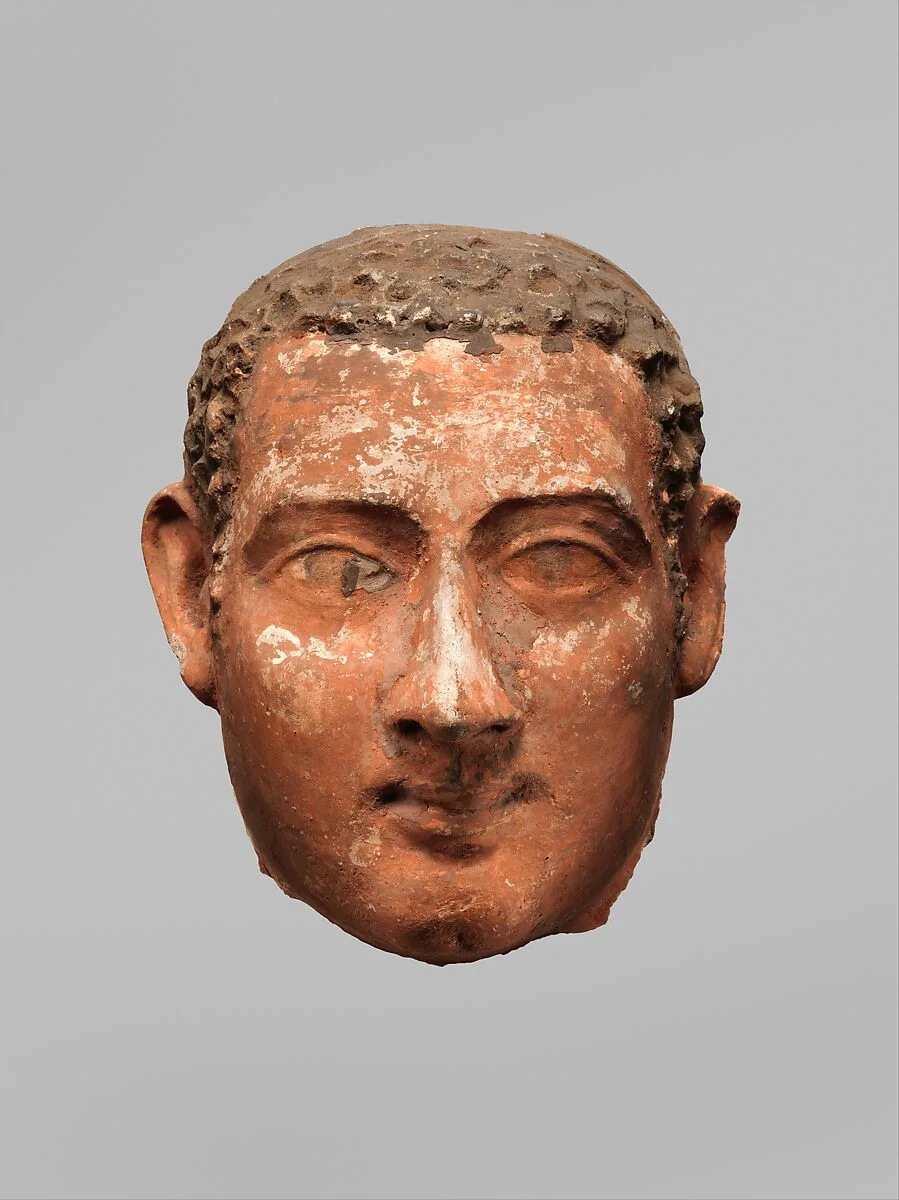 Mask of a man with short curly hair and long sideburns — Unknown