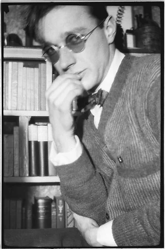 [Self-Portrait in Sunglasses Before Bookshelf, 48 Columbia Heights, Brooklyn, New York]