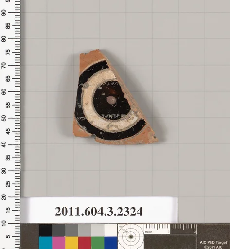 Terracotta fragment of a kylix: eye-cup (drinking cup)