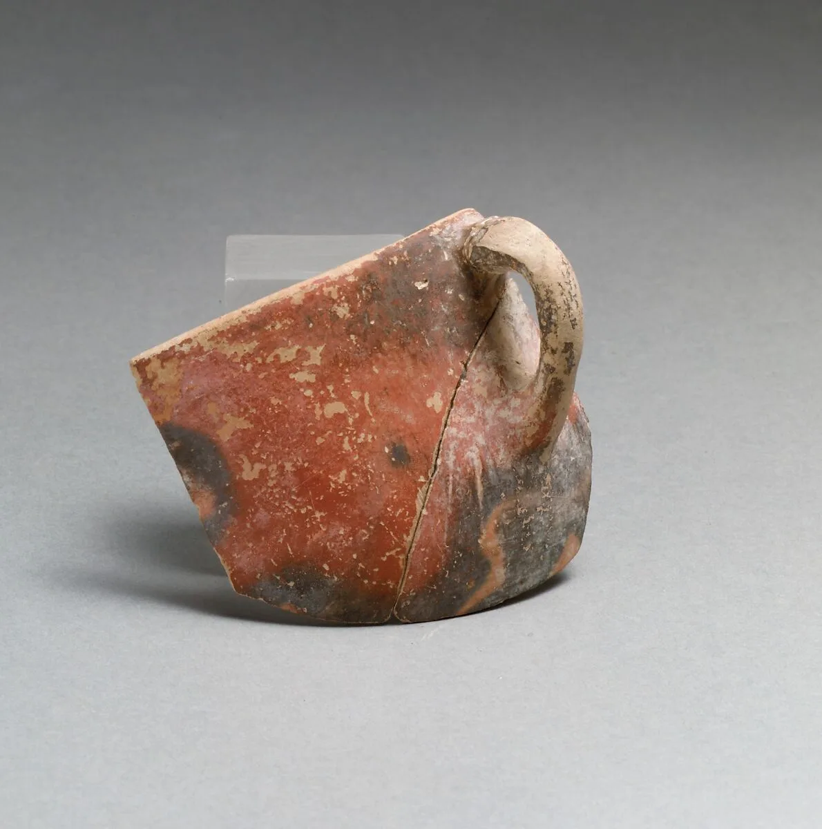 Terracotta rim, body and handle from a cup — Unknown