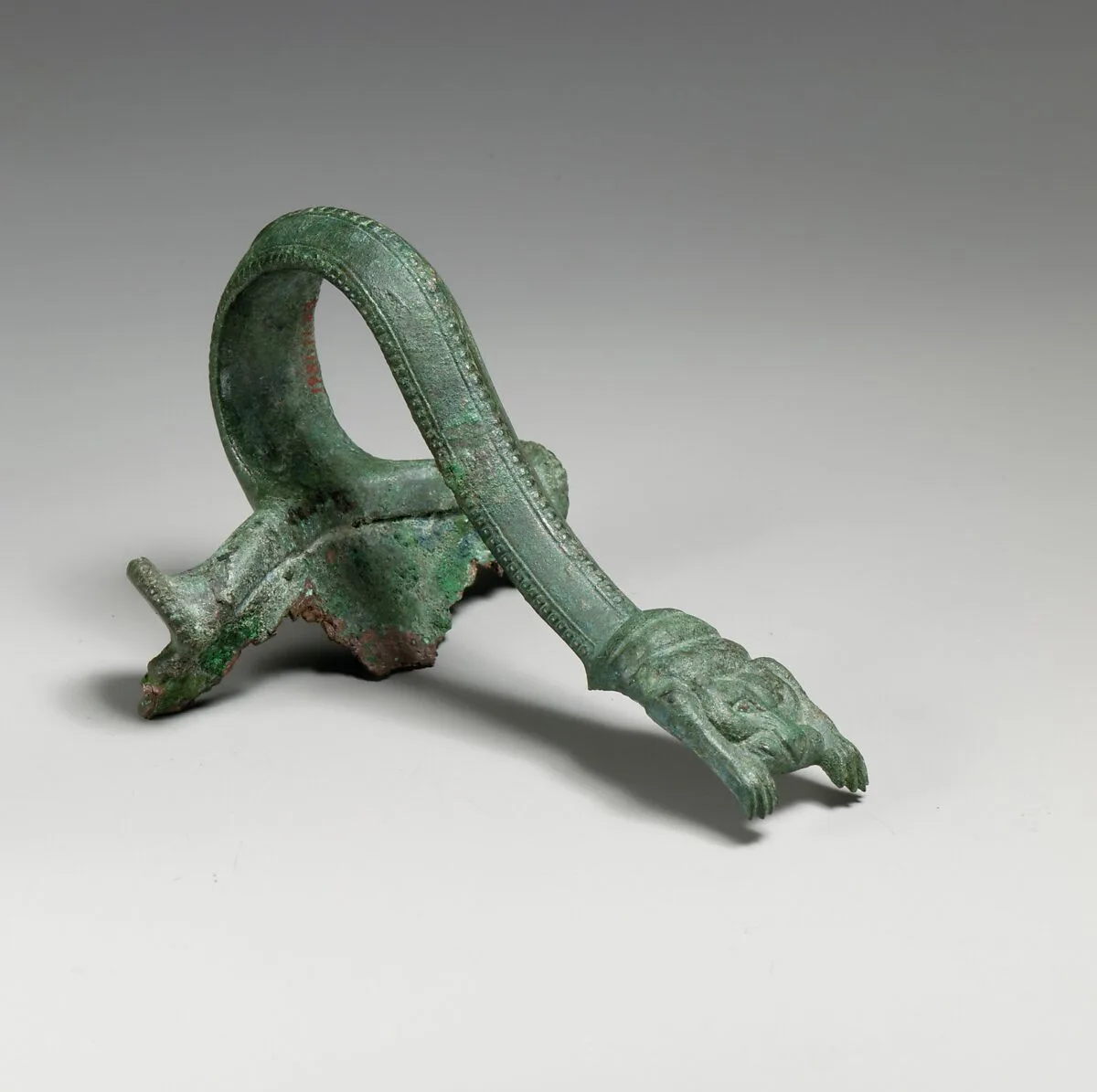 Bronze handle of an oinochoe (jug) — Unknown