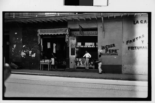 [Street Scene in Front of Lottery Ticket Shop "La Casa Pepe" and Fruit Market "La Casa Rafael", Havana]