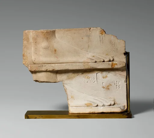 Sculptor's model / votive relief with two sides: side one, two registers with a right foot on each; side two, a royal-like figure