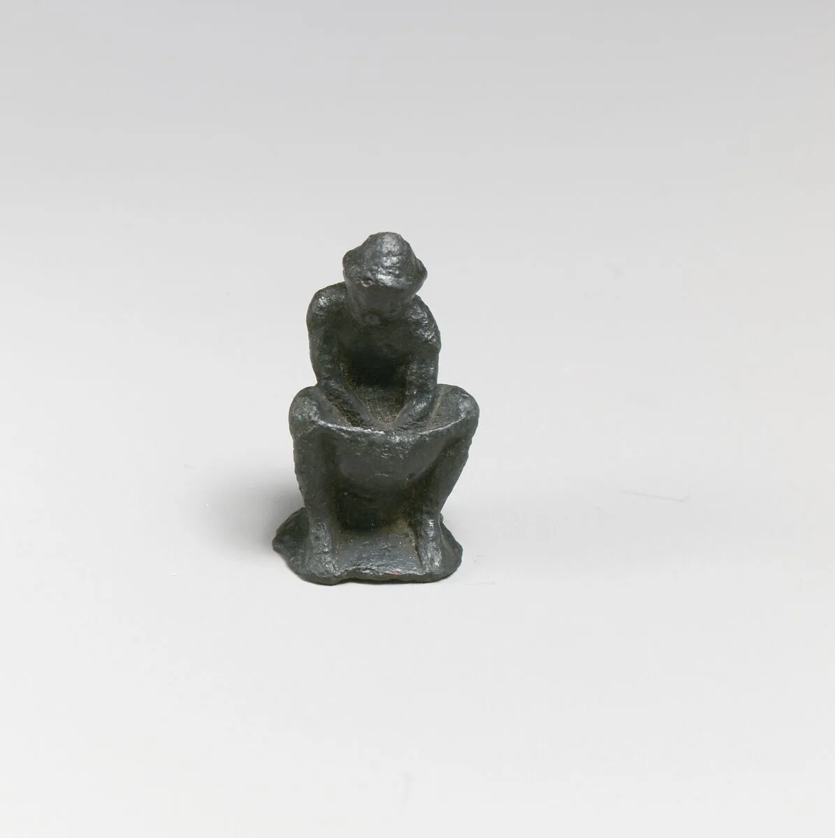 Bronze statuette of a man working — Unknown