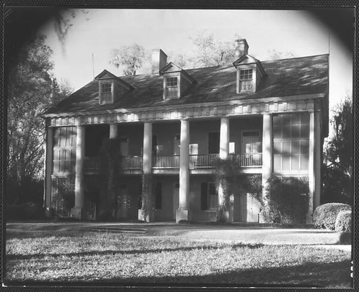 [Brick Greek Revival House with Ivy on Columns, Residence of Weeks Hall, New Iberia, Louisiana]