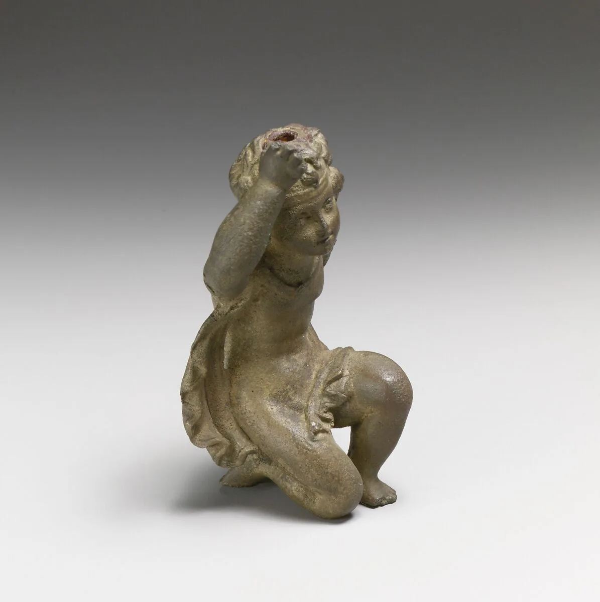 Bronze statuette of Eros kneeling — Unknown