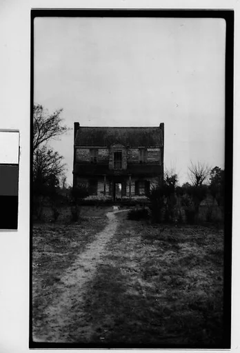 [Dilapidated Wooden House in Barren Field, Southeastern U.S.]