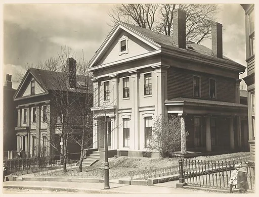 [Oblique View of Two Story House with Four Columns]