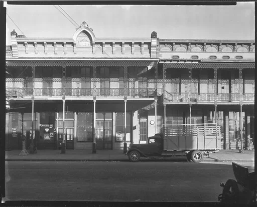 [Phoenix Building with Second Story Grillwork and Parked Flatbed Truck in Front on Water Avenue, Selma, Alabama]
