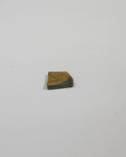 Mold-pressed amulet or fragment