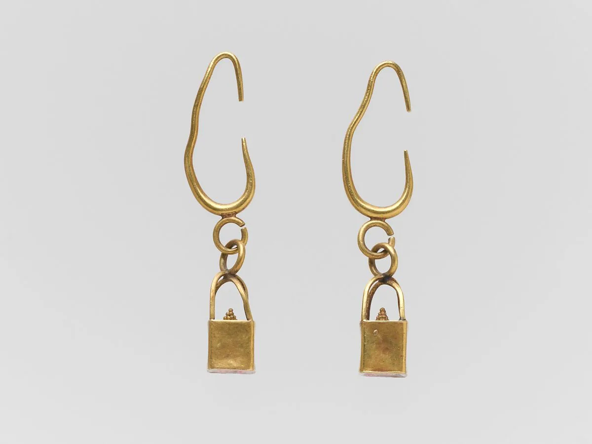 Pair of gold earrings with cage and ball pendants — Unknown