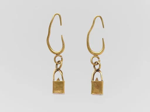 Pair of gold earrings with cage and ball pendants