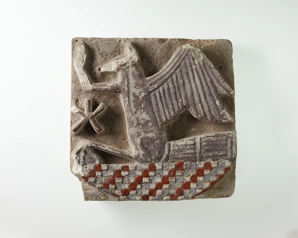 Tile in the form of a rekhyt bird surmounting a neb sign — Unknown