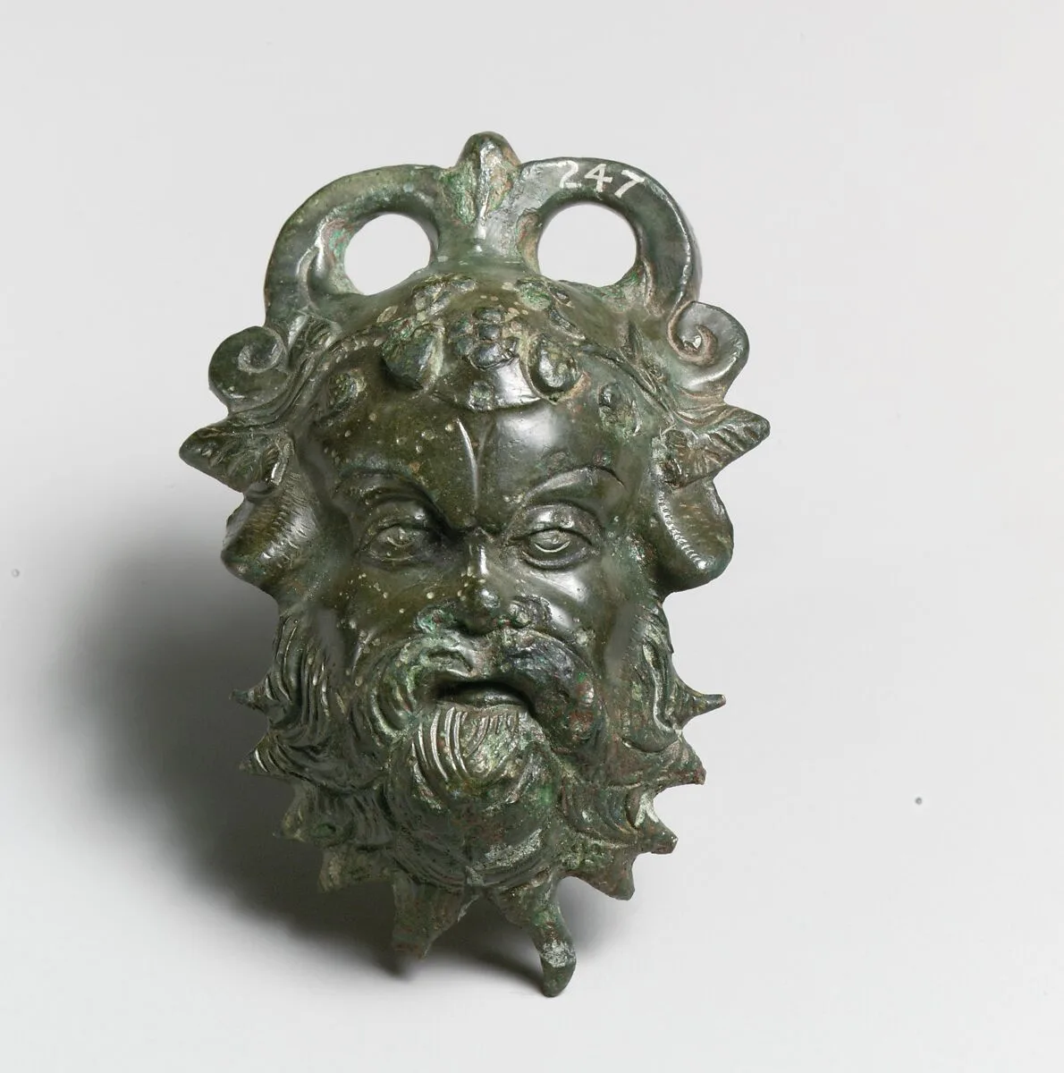 Bronze situla (pail) attachment in the form of a Silenos head — Unknown