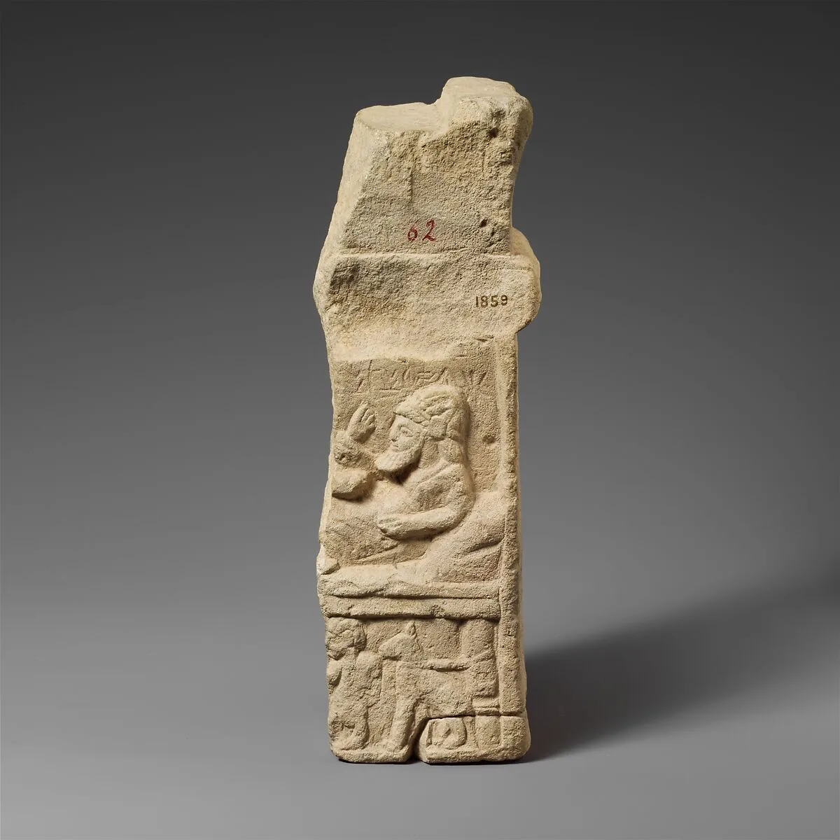 Limestone fragment of an altar with a relief — Unknown