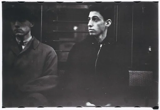 [Five 35mm Film Frames: Subway Passengers, New York City: Two Men, Older Woman]