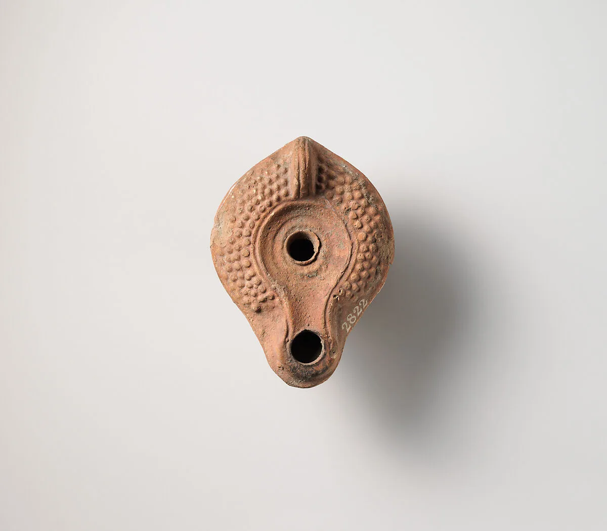 Terracotta oil lamp — Unknown