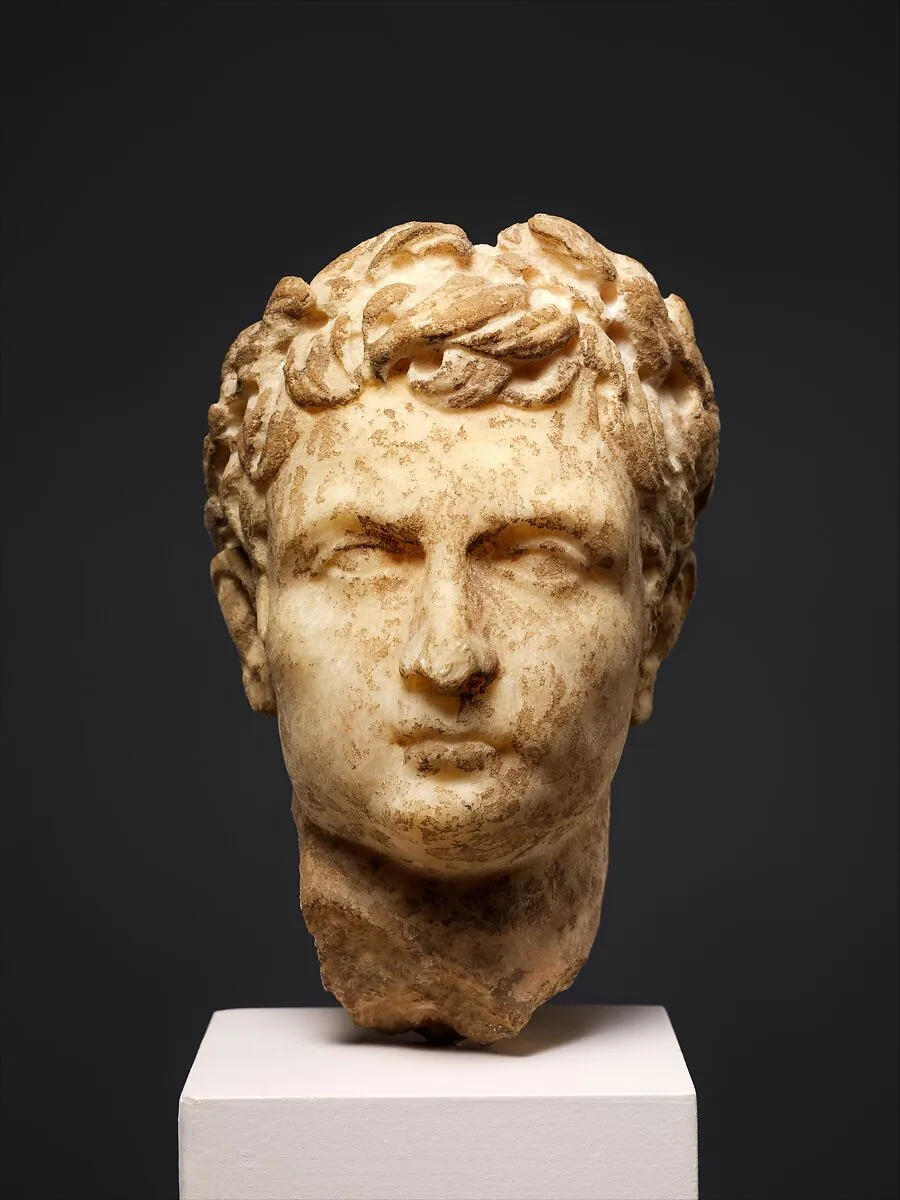 Marble head of a man wearing a laurel wreath — Unknown
