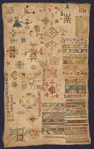 Sampler with geometric patterns, lettering, and various motifs