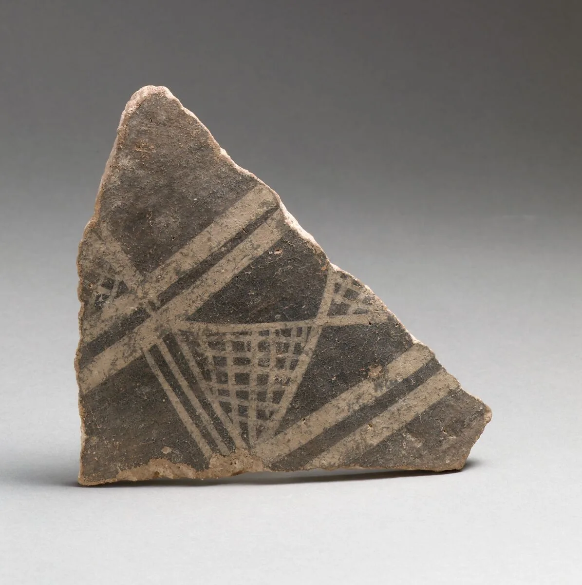 Terracotta vessel fragment with cross-hatched triangles and broad bands — Unknown