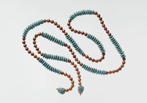 String of Beads with Feline-head Amulets