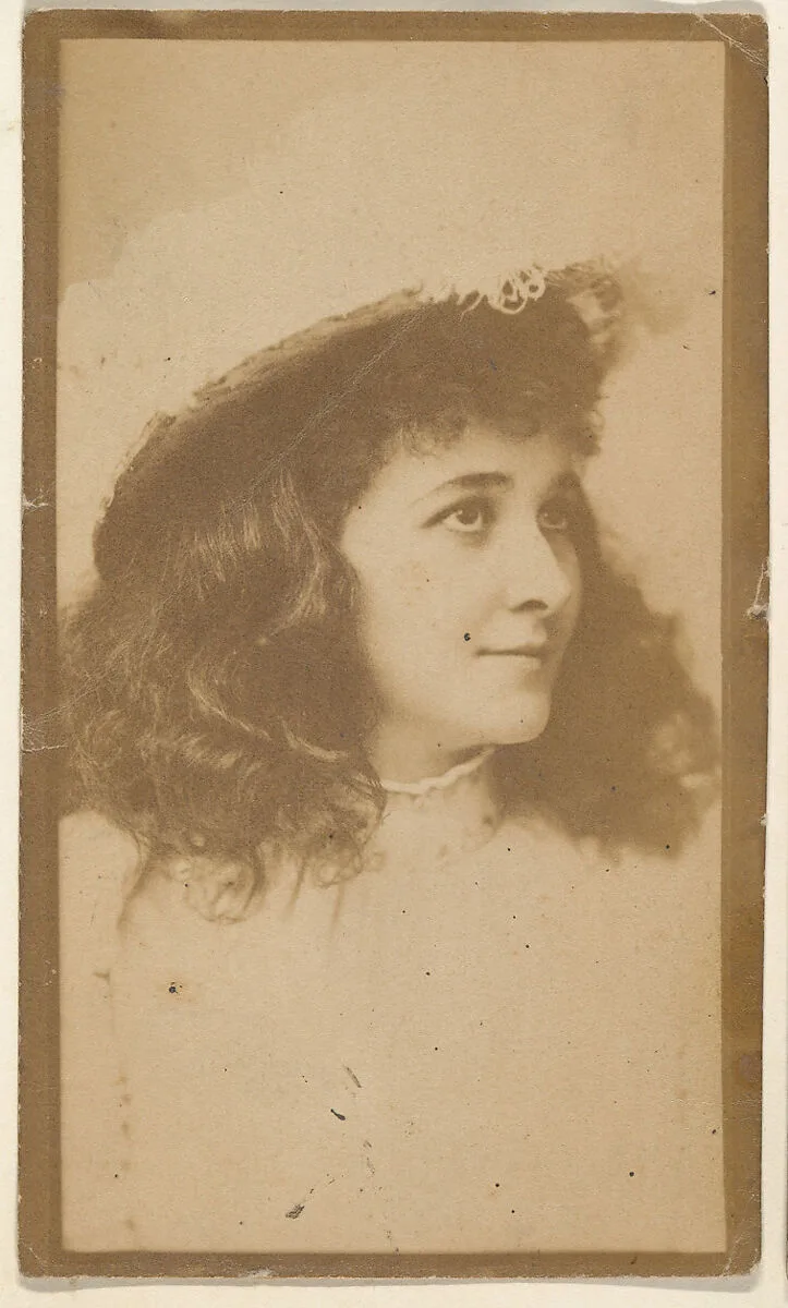 Portrait of actress wearing feathered hat, from the Actresses series (N668) — Unknown