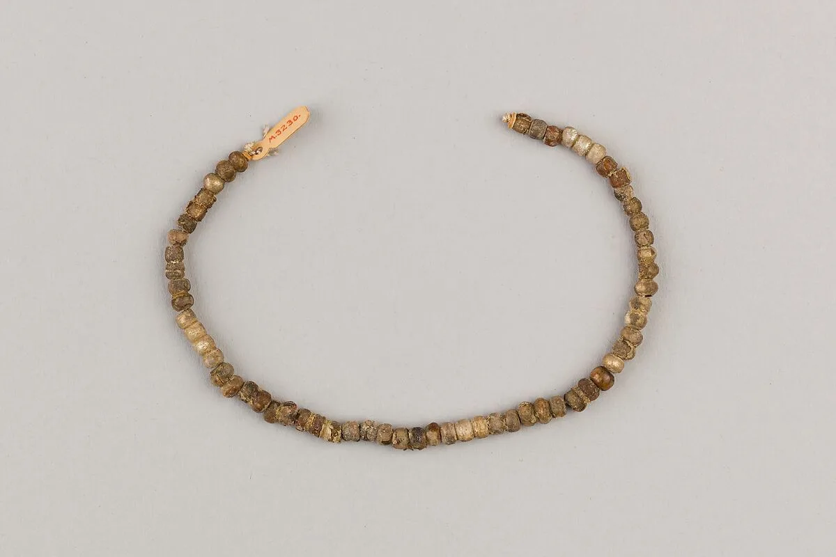 String of 61 spheroid beads — Unknown