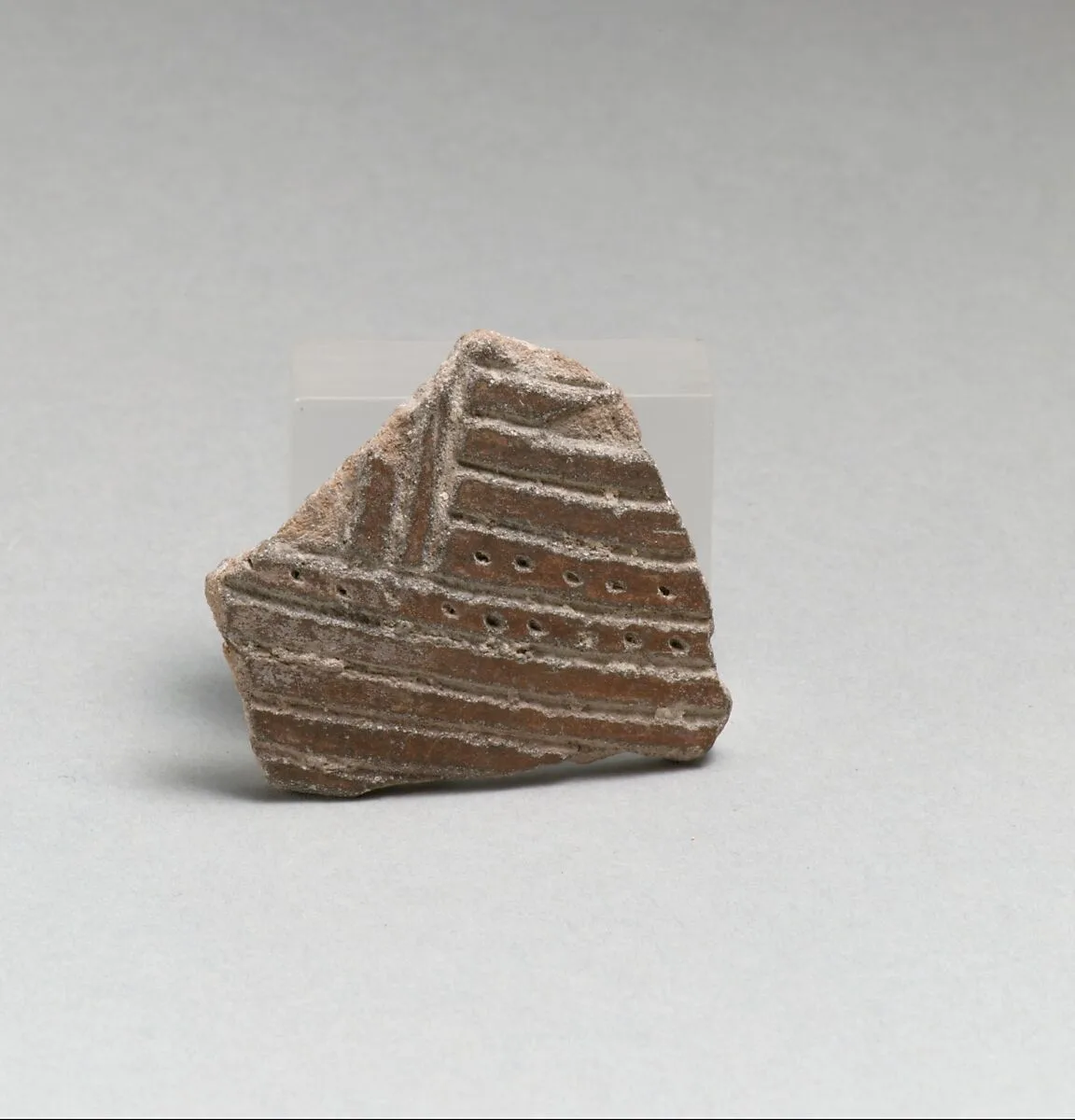 Terracotta vessel fragment with incised lines and punctations — Unknown