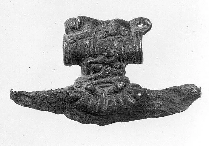 Crescent-shaped axe head with an iron blade — Unknown